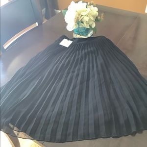 Black accordion style skirt
